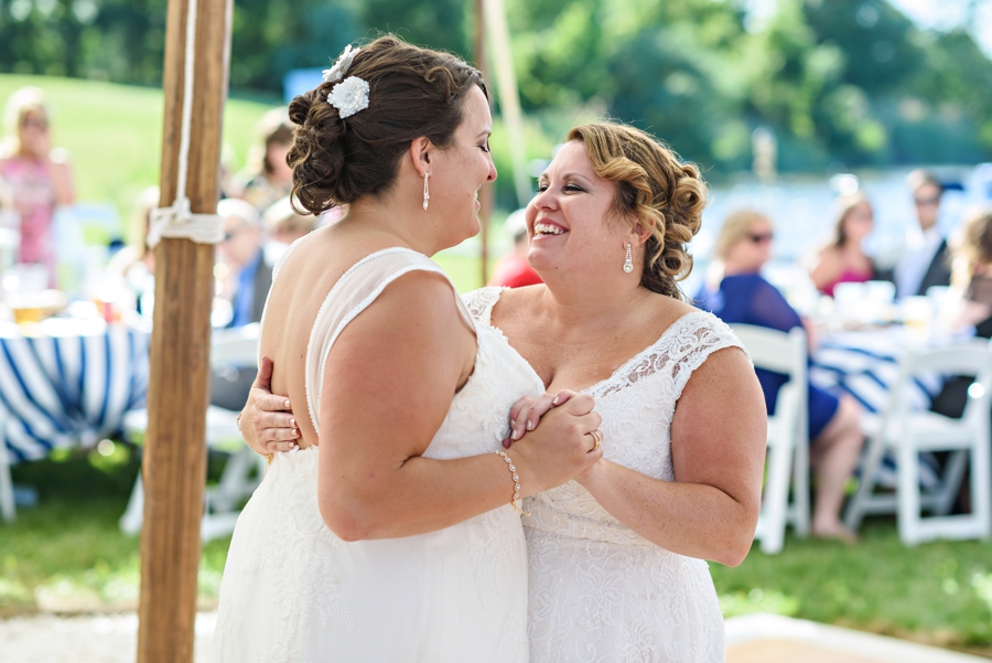 Two brides dancing during their first dance.